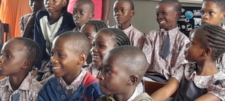 Two pupils laughing during a session