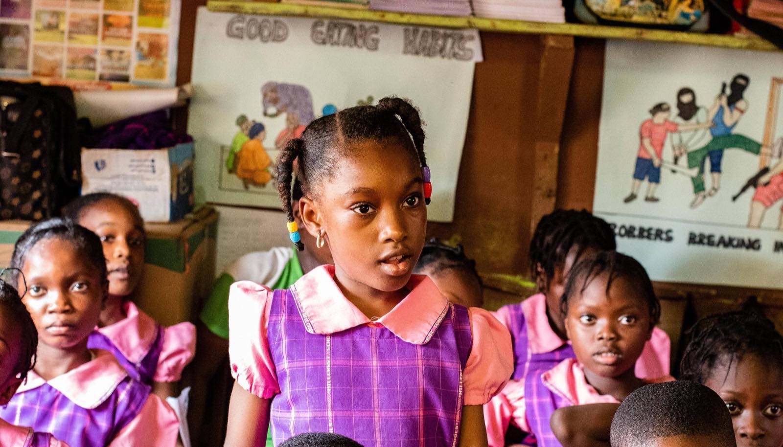 A pupil speaking up during a class session
